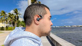 JLab Epic Air Sport ANC earbuds worn by reviewer assessing sound quality