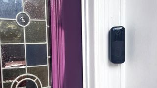 Blink Video Doorbell Gen 2 mounted beside purple door
