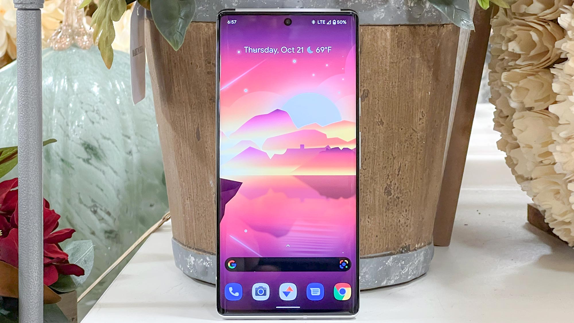 pixel 6 pro standing against basket with display on