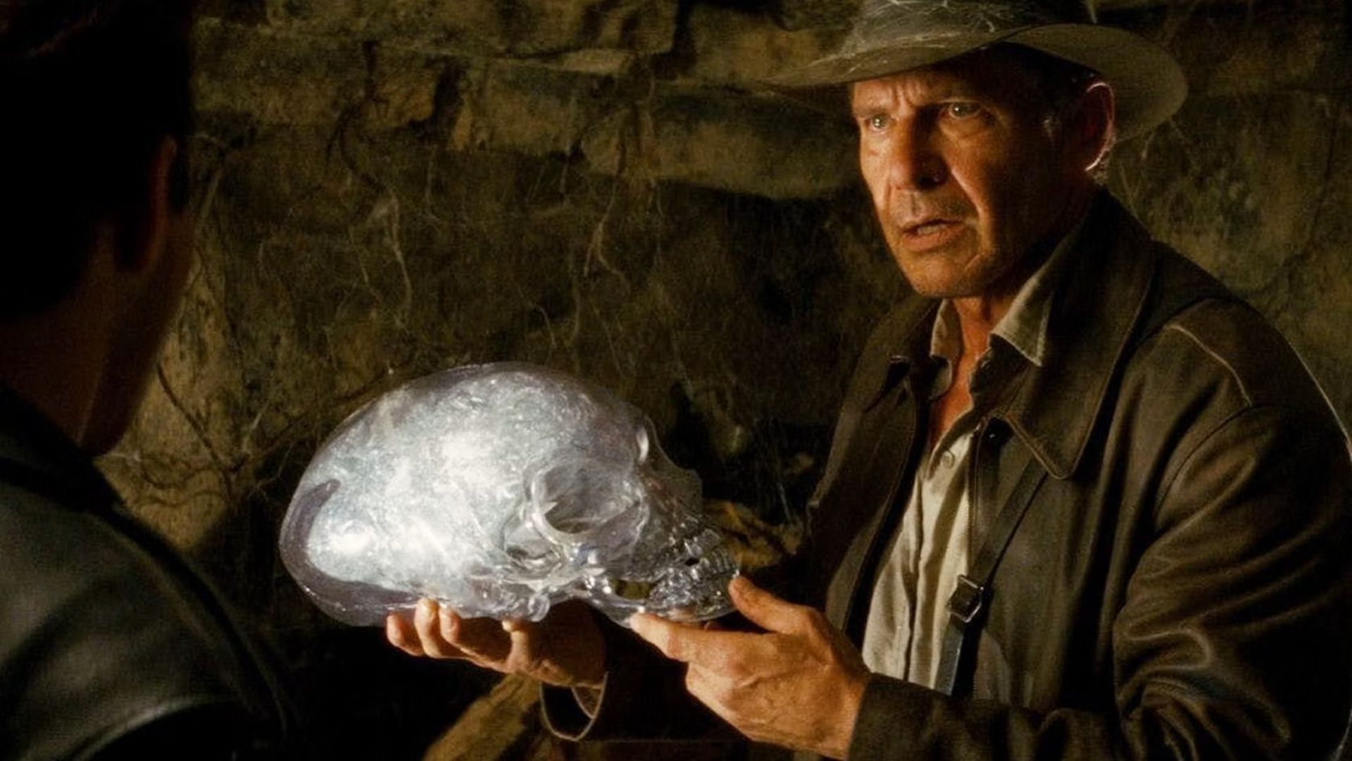 Harrison Ford's Indiana Jones holding an alien skull in Kingdom of the Crystal Skull