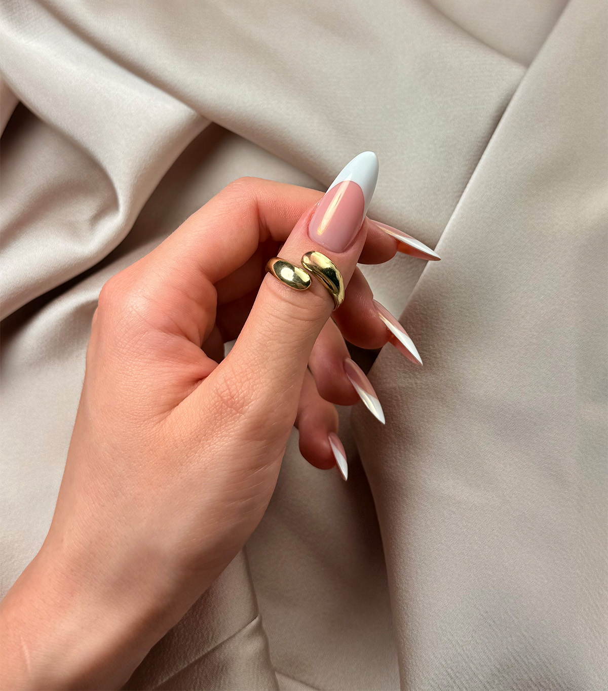 A classic chrome French manicure by Sofiia Mazur.