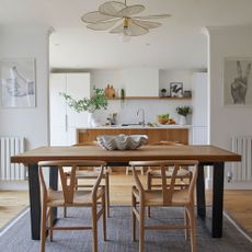 Wooden table in white kitchen diner
