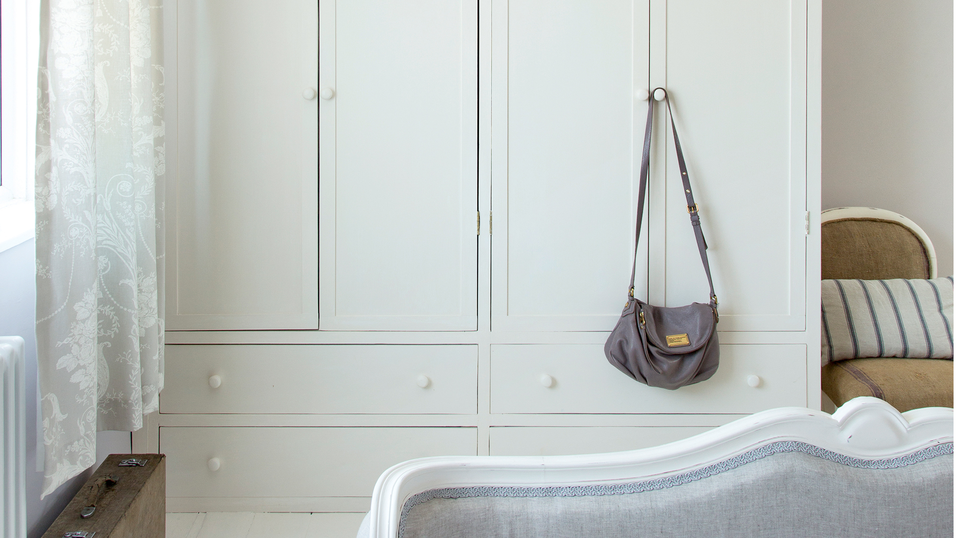 White bedroom with white wrdrobes