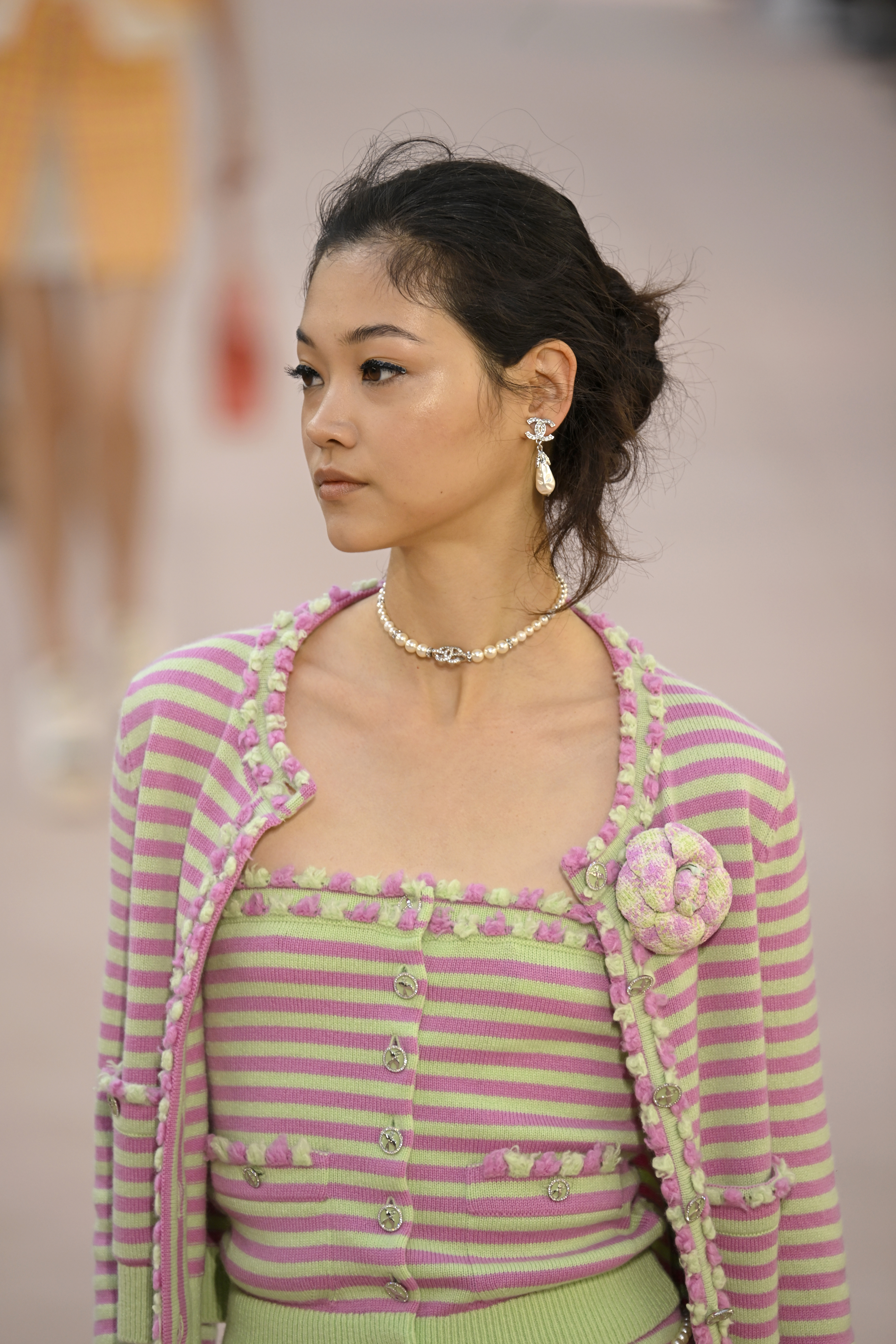 Model wearing pearl jewellery at Chanel SS25