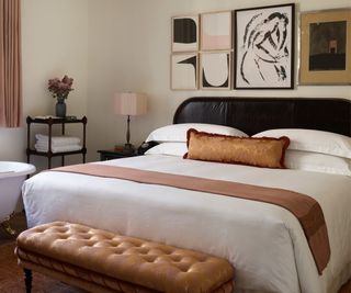 A bed at NoMad Lonon, showing the detail on the leather headboard
