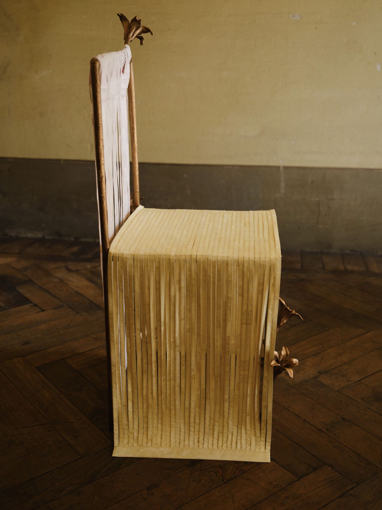 bronze furniture draped in pastel ribbons