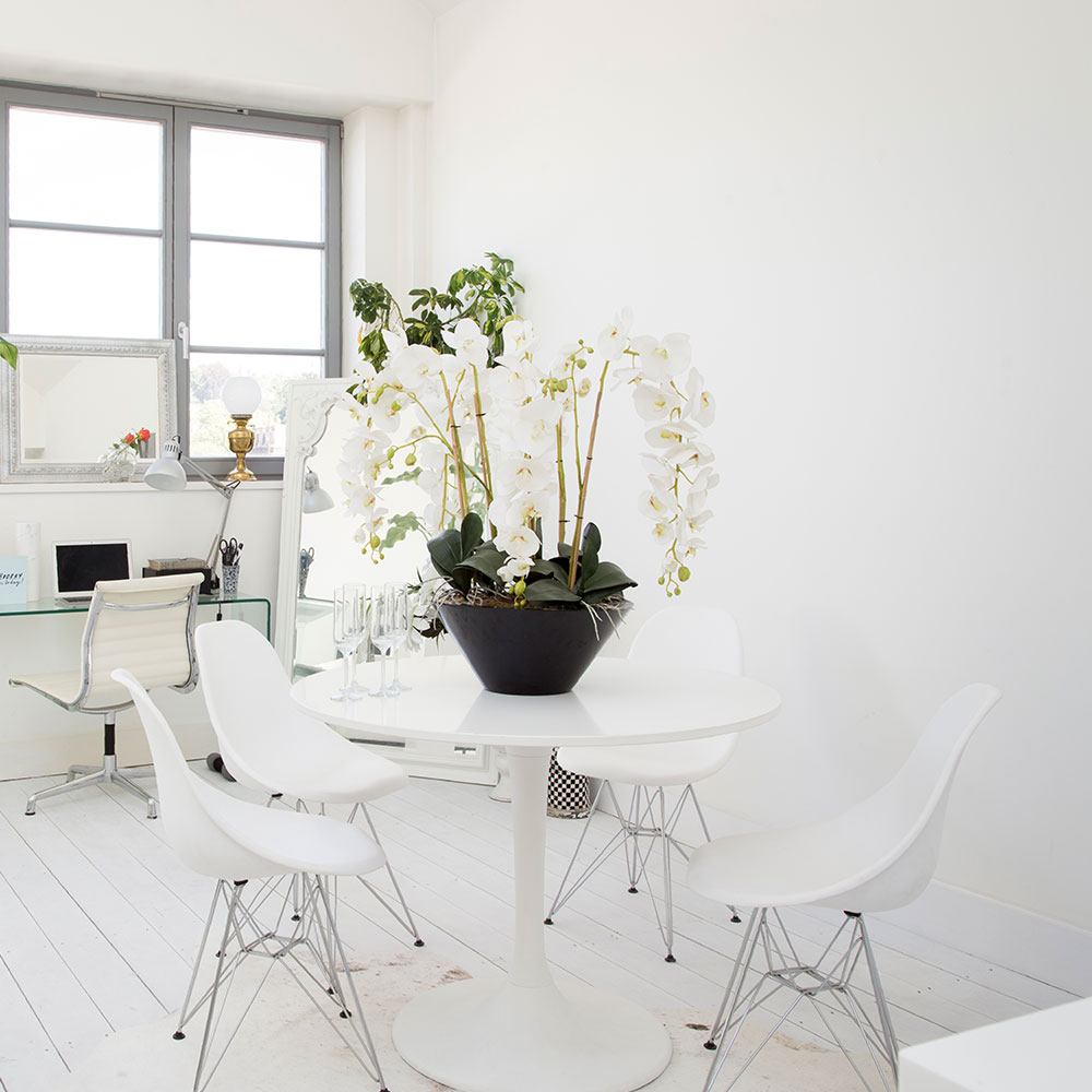 dining area with tulip table and eames style chairs