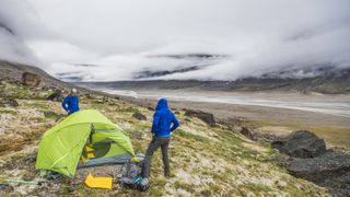 Two campers set up as a storm approaches