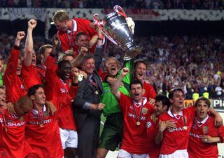 Manchester United celebrate with the Champions League trophy after beating Bayern Munich in the 1999 final, completing a treble