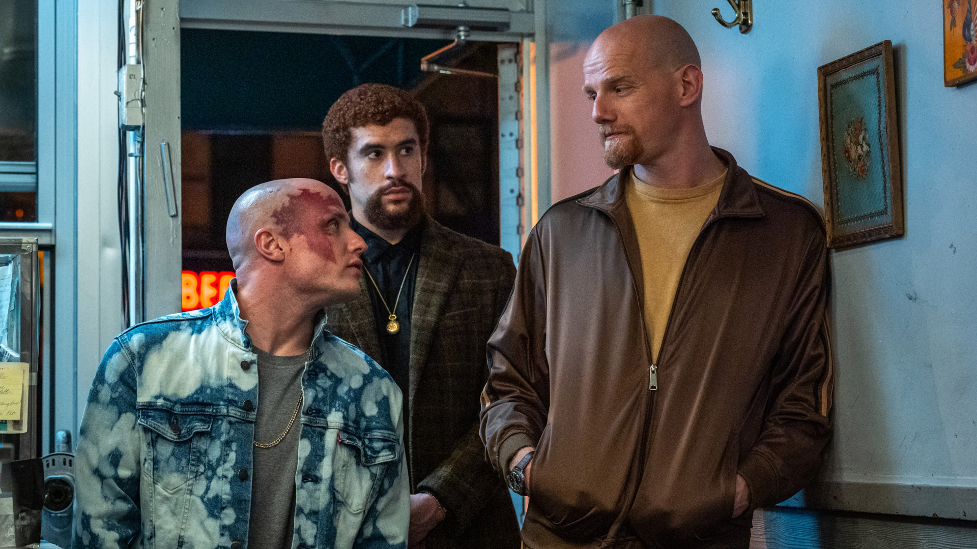 Bad Bunny stands next to Yuri Kolokolnikov and Nikita Kukushkin in Caught Stealing