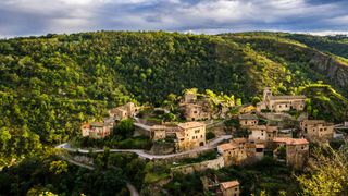 green hills and small village in Rhône Valley, France