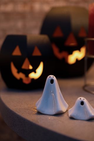 Two ceramic ghost decorations
