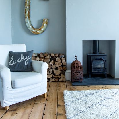 berber rug in living room with log burner