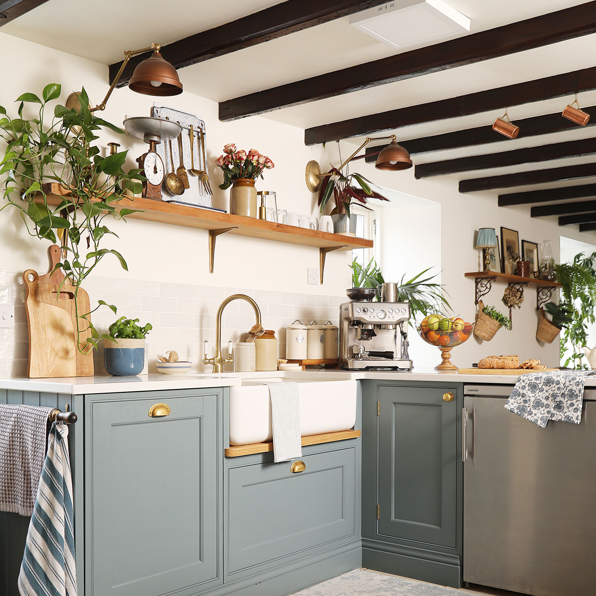 Blue and white kitchen with brass and copper accents