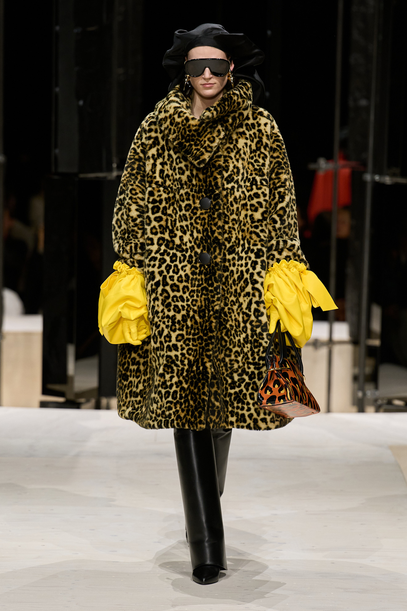 a model wears leopard coat