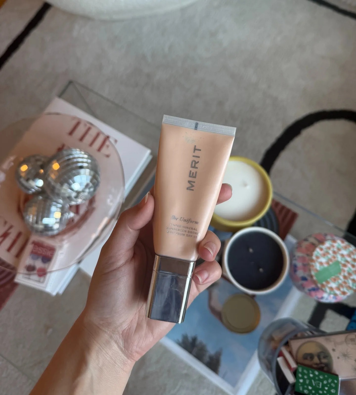 Schneider holding Merit's The Uniform.