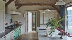 Rustic cream kitchen with island and marble countertops