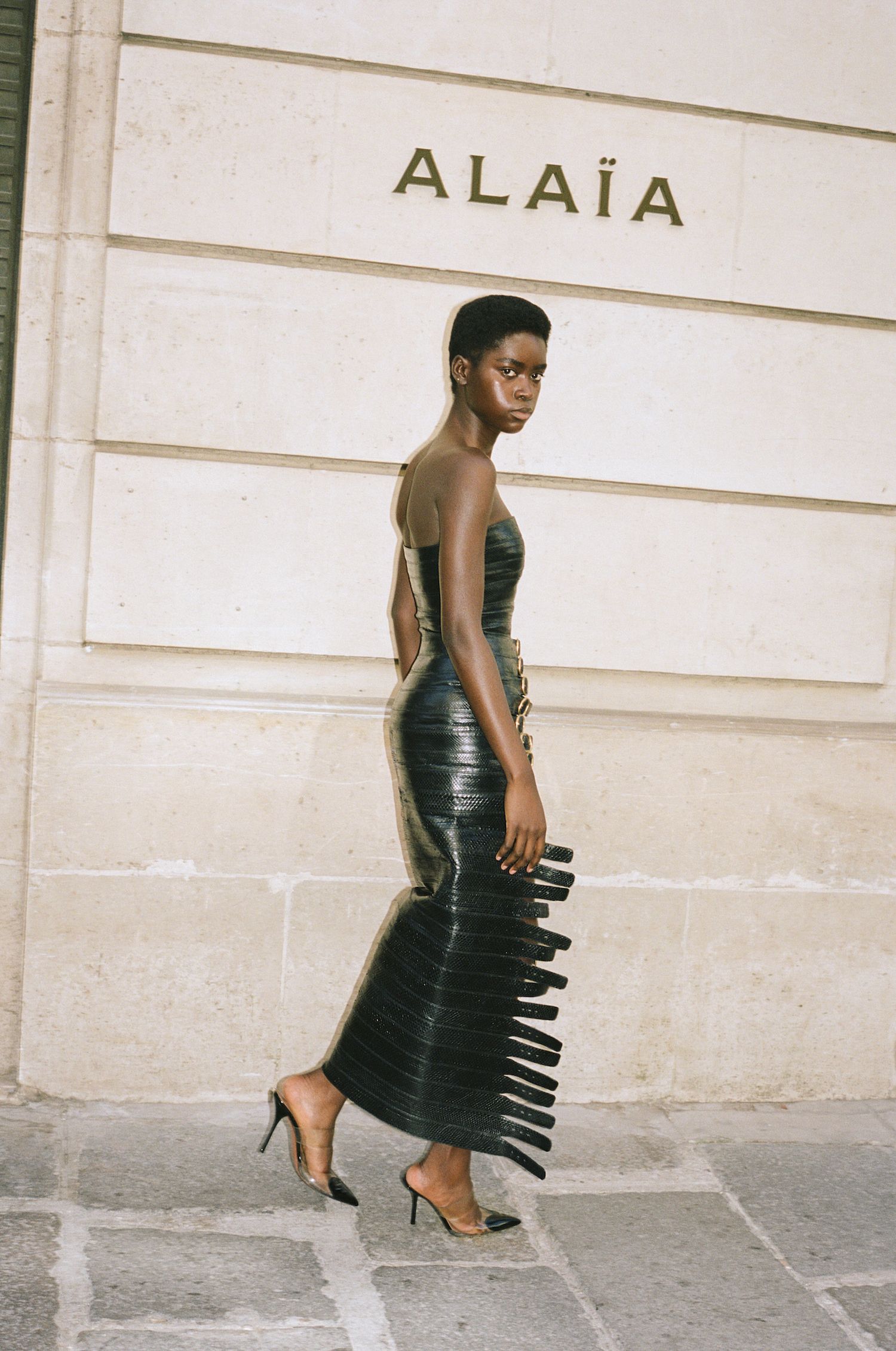 Woman in Alaïa dress outside Alaïa store