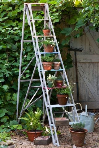 wahitewashed step ladder with painted rungs