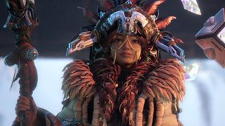 Light of Motiram extended trailer still - woman in tribal headgear holding a staff