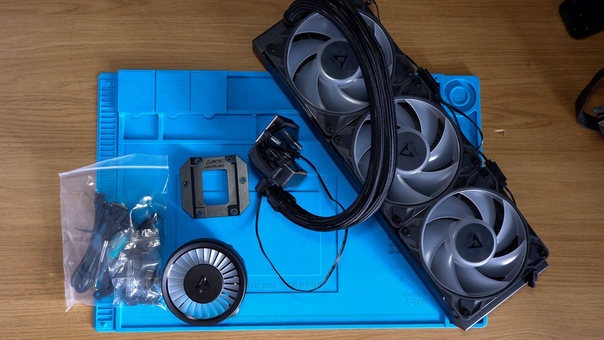 An Arctic Liquid Freezer III Pro liquid cooler set-up on a test bench with the RGB enabled.