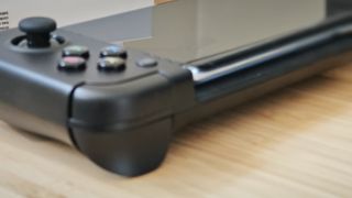 A black GameSir X2 Pro controller sitting on a desk