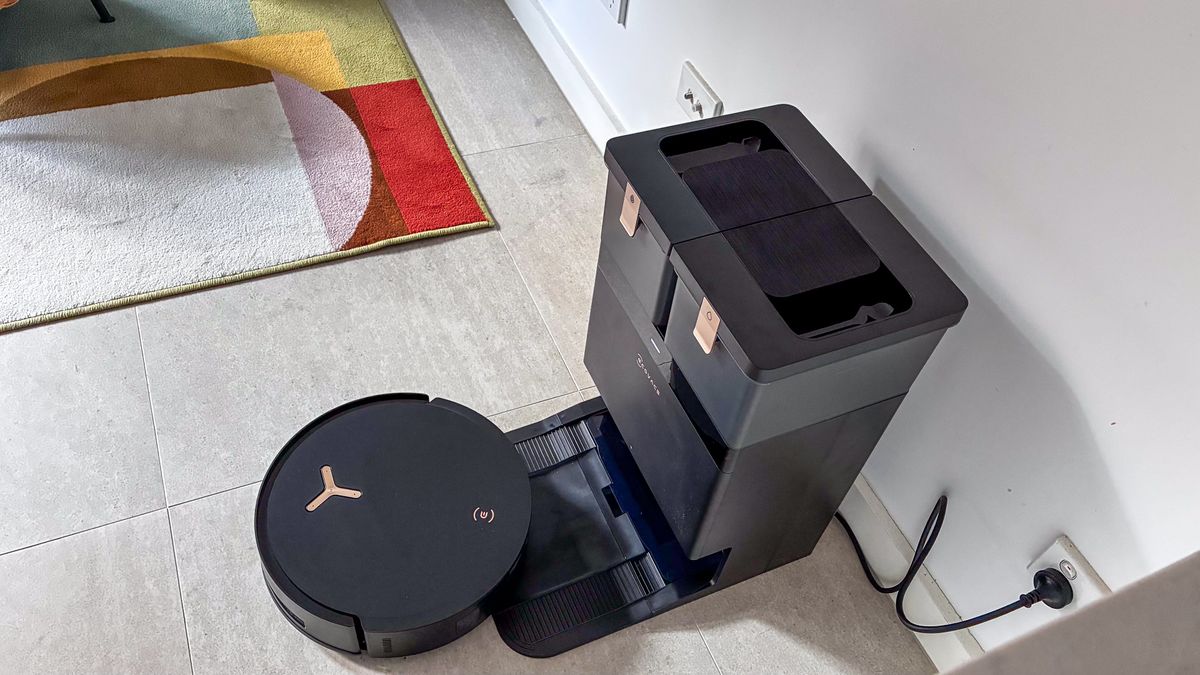 A top-down view of the Ecovacs Deebot X8 Pro Omni with the robot exiting the base station