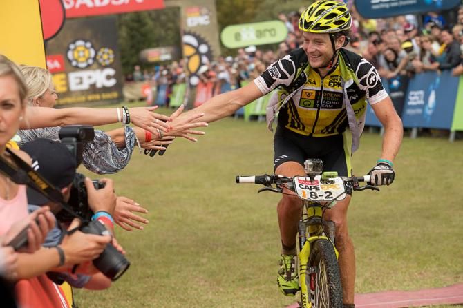 All African Jersey holders Gert Heyns (centre left) and Matthys Beukes (centre right) of SCOTT Factory Racing celebrate winning the final stage as Nino Schurter (far left) and Philip Buys (far right) of Scott-Odlo MTB Racing celebrate finishing second during the final stage