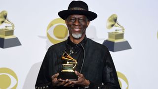 US musician Keb' Mo' poses in the press room with the award for Best Americana Album for "Oklahoma" during the 62nd Annual Grammy Awards on January 26, 2020, in Los Angeles.