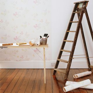room with wooden flooring with wooden ladder