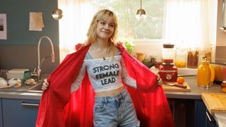 Wanda Klatt smiling and wearing a t-shirt with 'Strong Female Lead' on the front.