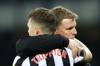 Newcastle United player Kieran Trippier is embraced by his Manager Eddie Howe after the team's defeat in the Premier League match between Everton FC and Newcastle United at Goodison Park