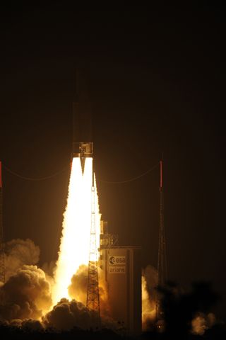 An Ariane 5 rocket carrying the European Space Agency's ATV-3 cargo ship Edoardo Amaldi lights up the night after a dazzling liftoff just after 12 a.m. EDT from Guiana Space Center in Kourou, French Guiana.