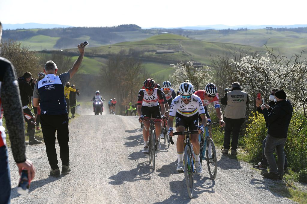 SIENA ITALY MARCH 06 Tadej Pogacar of Slovenia and UAE Team Emirates Julian Alaphilippe of France and Team Deceuninck QuickStep Mathieu Van Der Poel of Netherlands and Team AlpecinFenix during the Eroica 15th Strade Bianche 2021 Mens Elite a 184km race from Siena to Siena Piazza del Campo Breakaway Gravel Strokes Dust StradeBianche on March 06 2021 in Siena Italy Photo by Tim de WaeleGetty Images