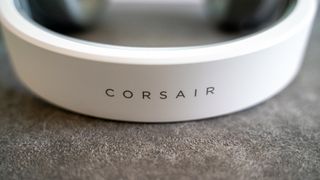 Corsairs HS65 Wireless on a gray desk mat