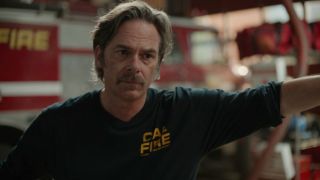 Billy Burke as Vince cleaning the fire station in Episode 4 of Fire Country.