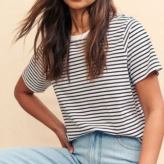 Flat lay image of woman in a t-shirt