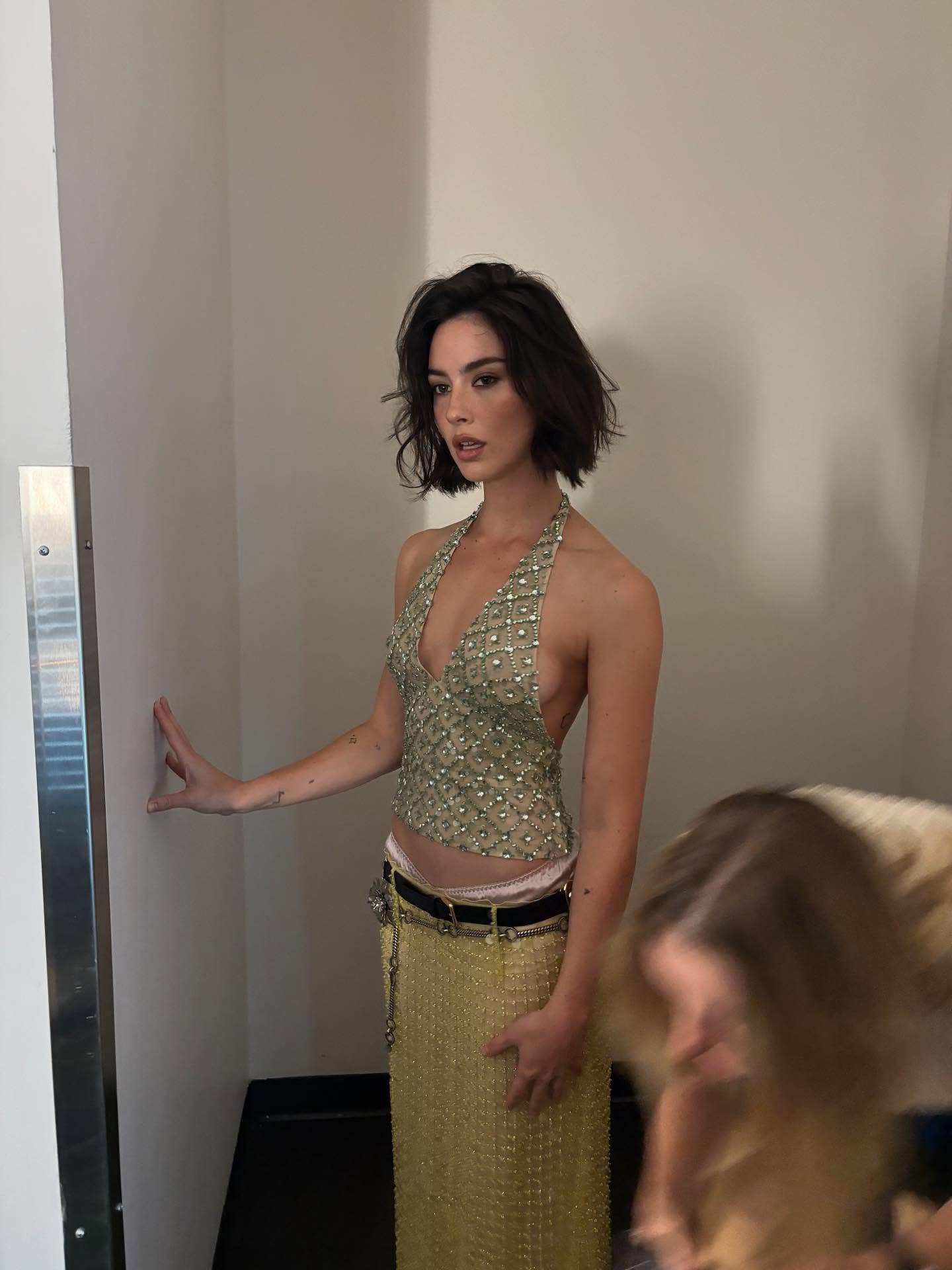 Singer Gracie Abrams posing for a photo backstage at Madison Square Garden.