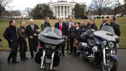 Donald Trump talks with Harley Davidson executives at the White House in 2017