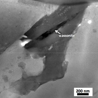 This scanning transmission electron microscope image shows the Wassonite grain in dark contrast.