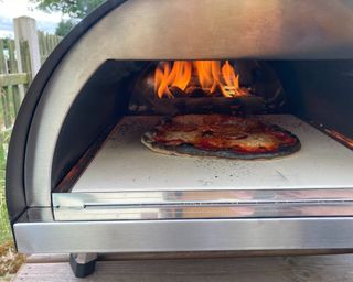 burning pizza in the woody pizza oven