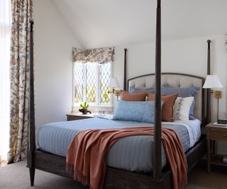 Four poster bed in French style country bedroom