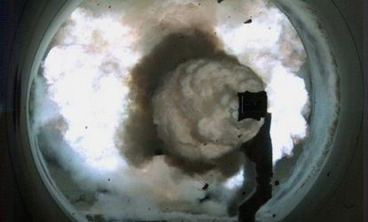 A high-speed camera image of the Electromagnetic Railgun -- an electrically powered, long-range gun launch system.