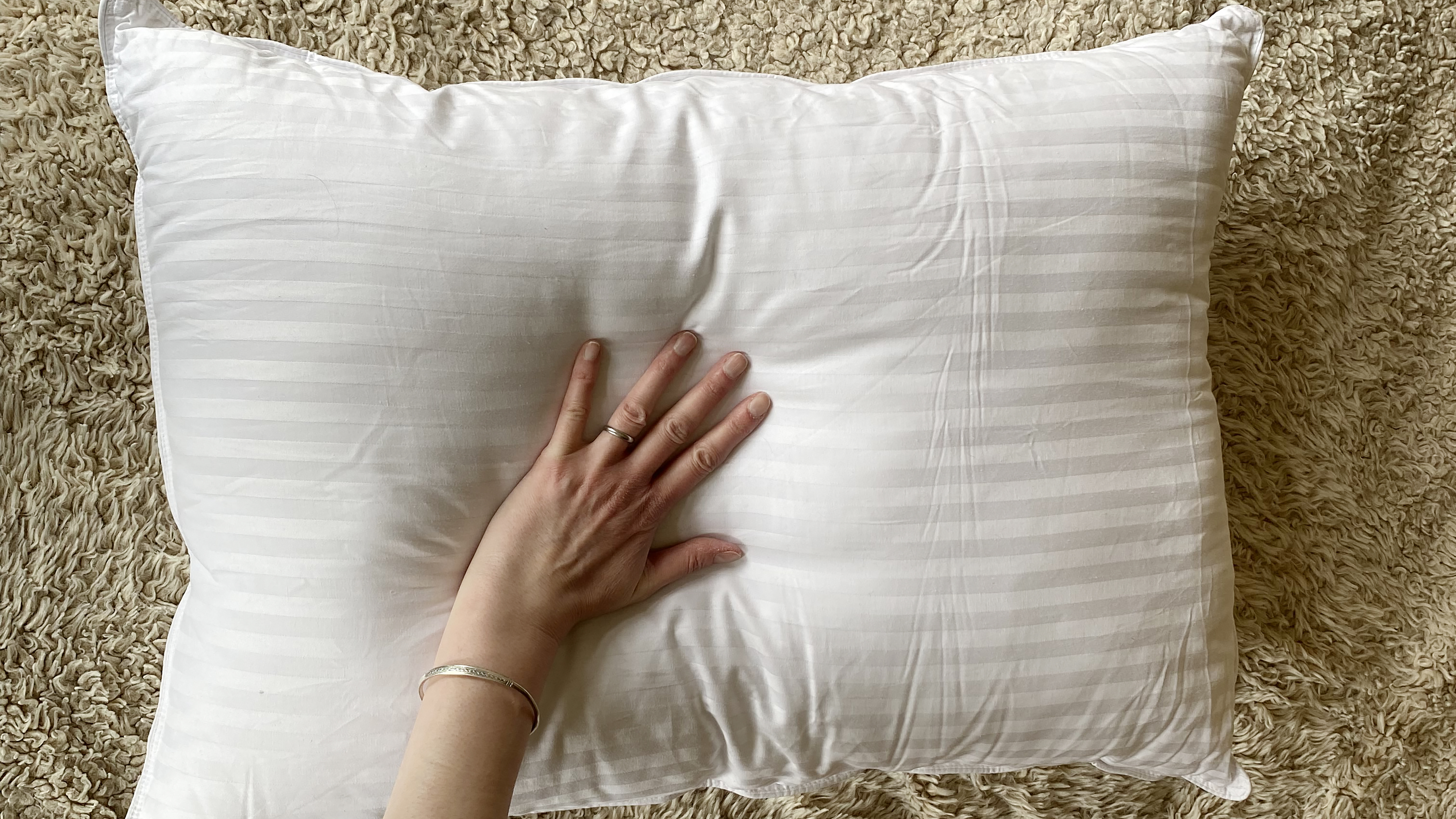 Testing the firmness and comfort of the Beckham Hotel Collection Gel Pillow