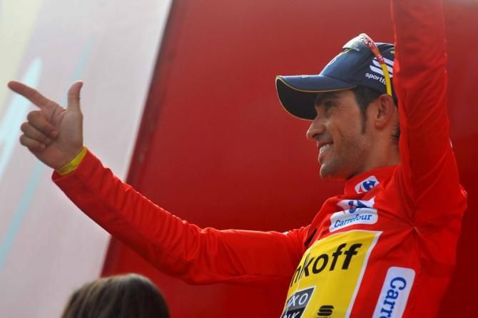 Alberto Contador (Tinkoff-Saxo) fires the pistol on the podium