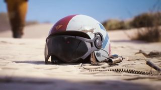 Arc Raiders screenshot of a helmet lying in sand