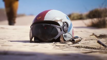 Arc Raiders screenshot of a helmet lying in sand