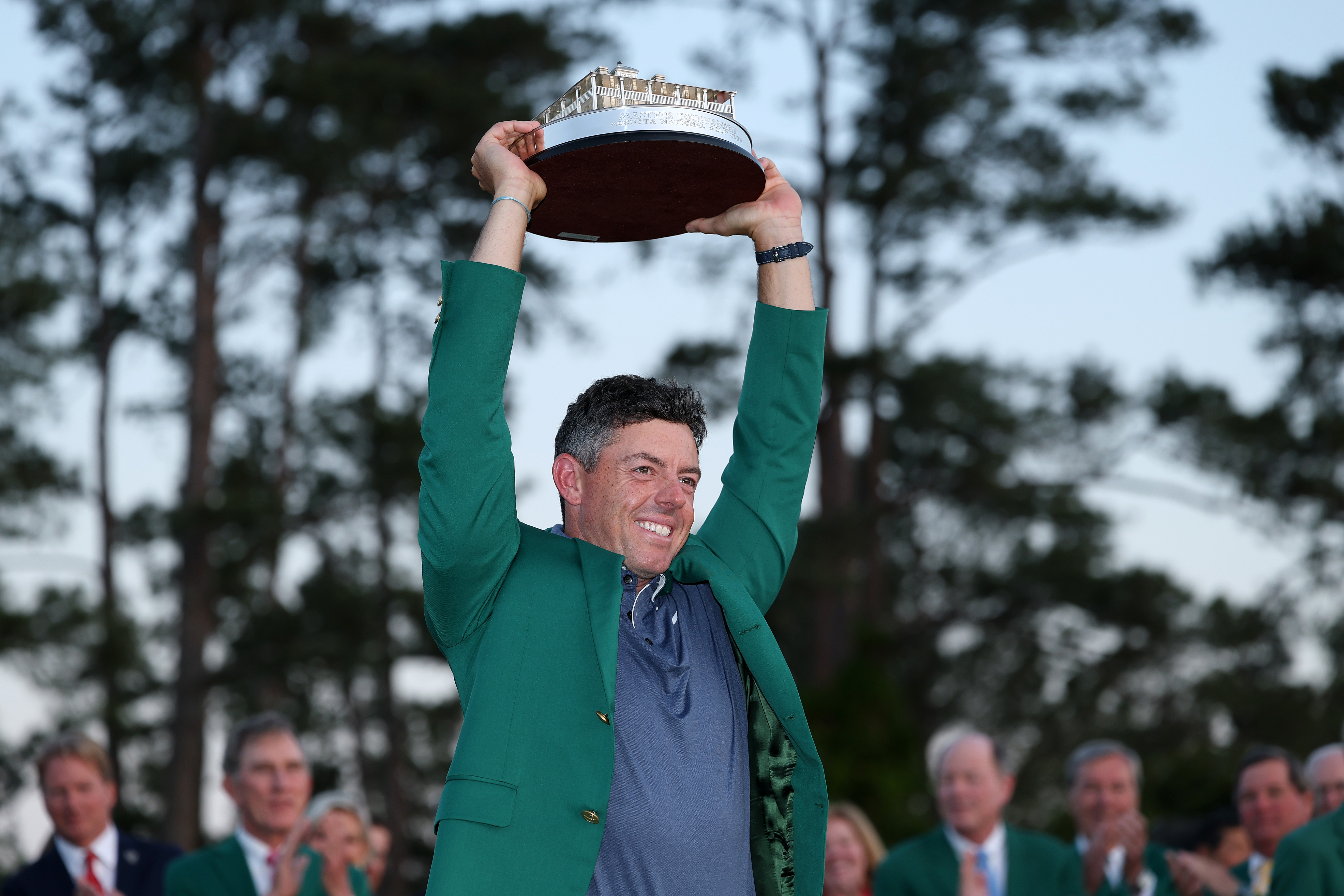 Rory McIlroy lifts The Masters trophy in the air