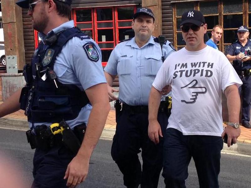 Australian man arrested for wearing &amp;#039;I&amp;#039;m with Stupid&amp;#039; shirt at political event