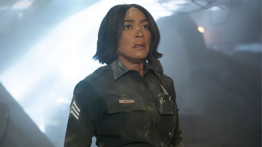 Athena looks into the distance in fear 